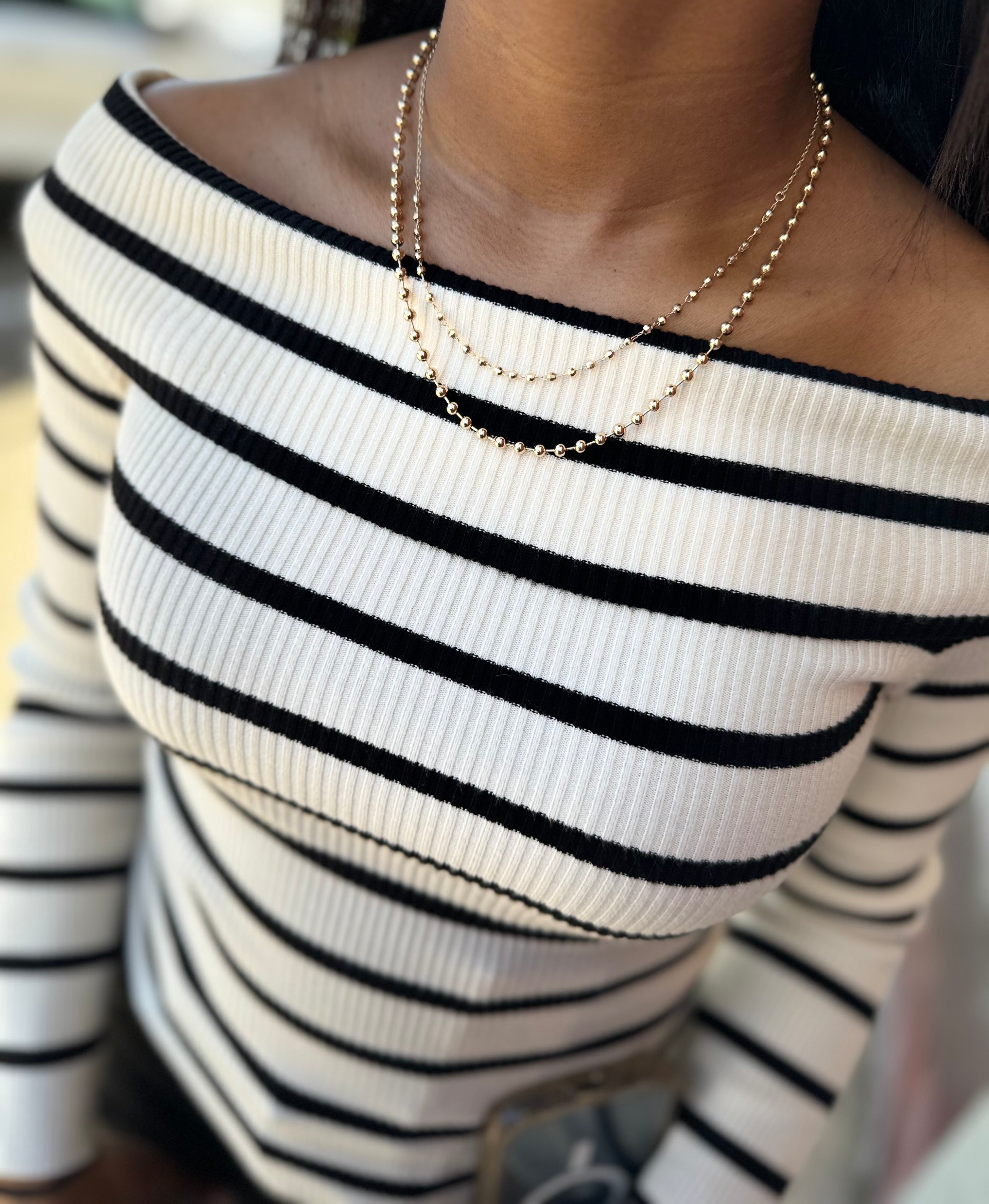 Trendy Off-The-Shoulder White and Black Striped Sweater.