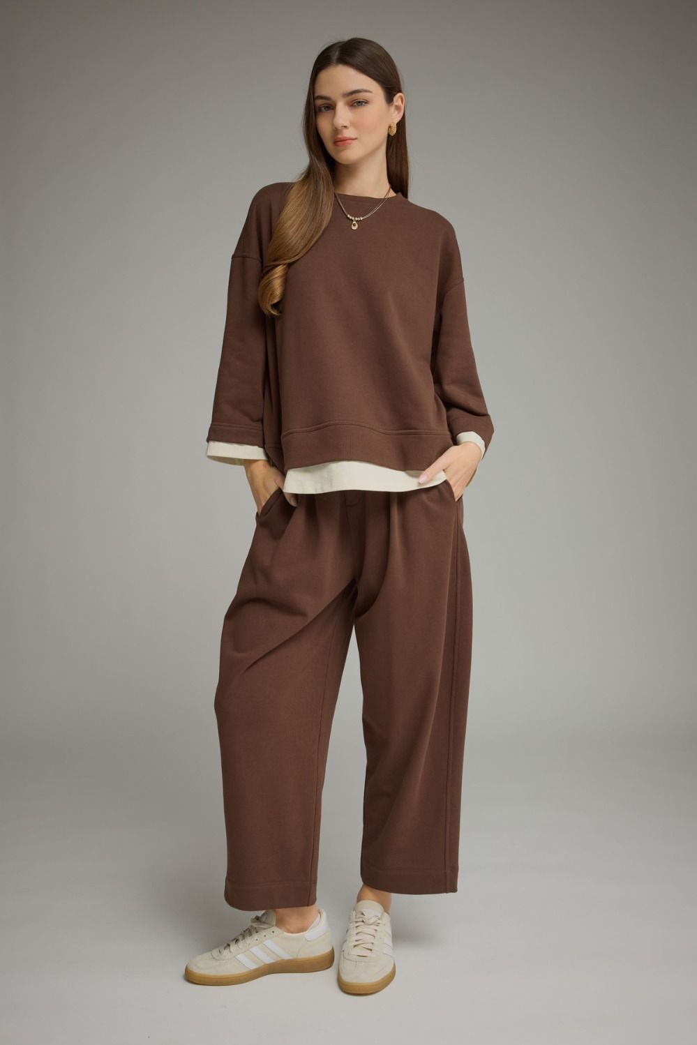Brown long sleeve top with a round neckline